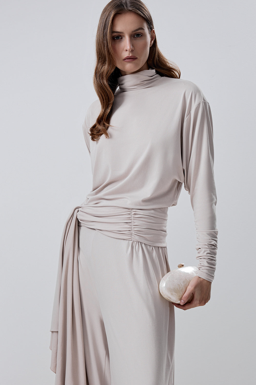 Long-sleeve top with a high neck and a waistband