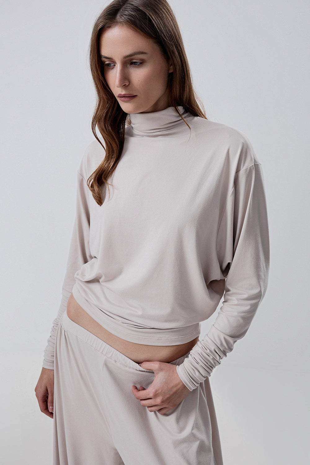 Long-sleeve top with a high neck and a waistband