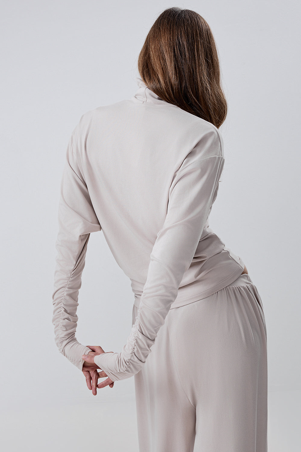 Long-sleeve top with a high neck and a waistband