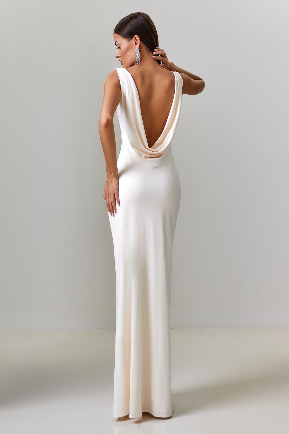 Dress with drapery on the back