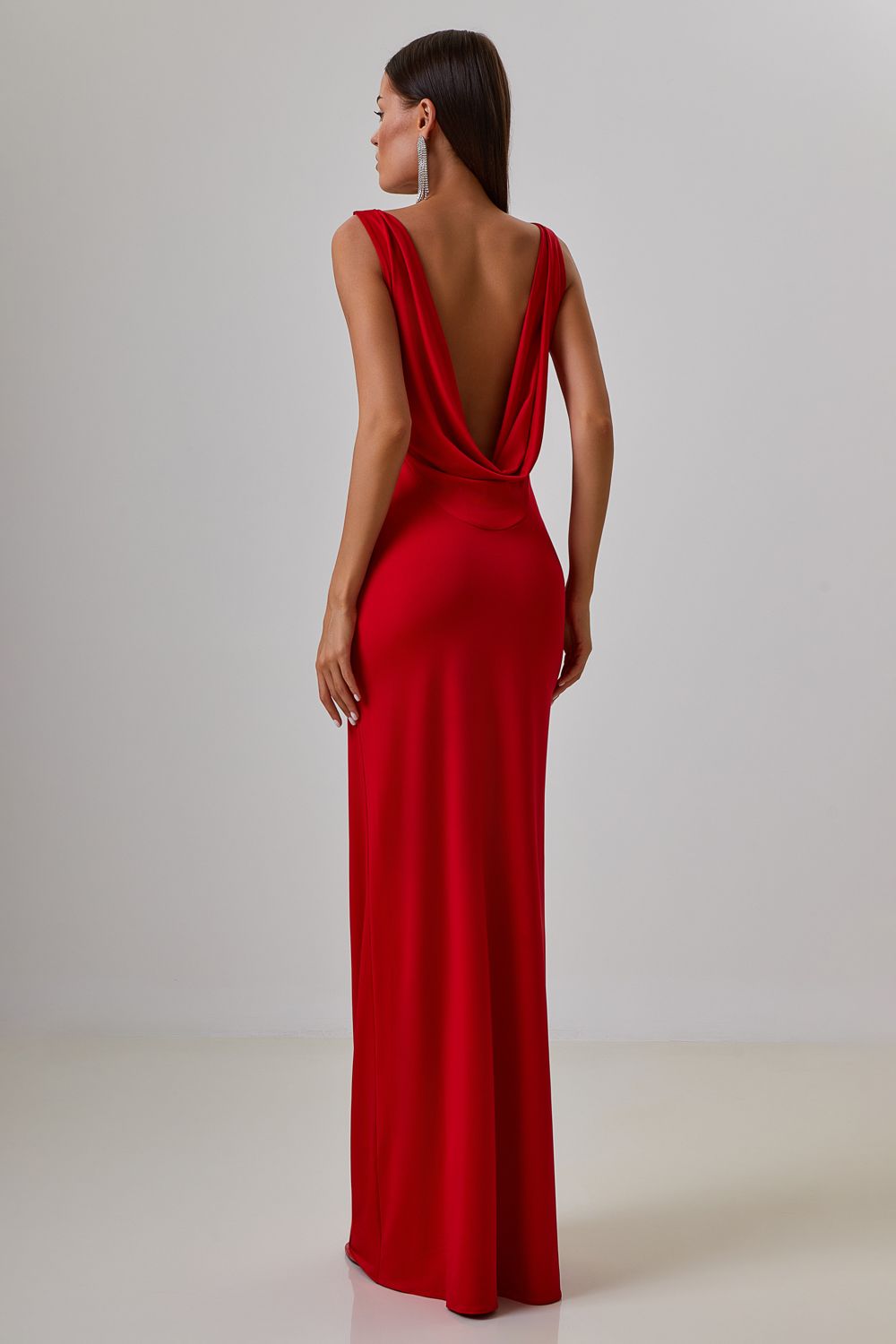 Dress with drapery on the back