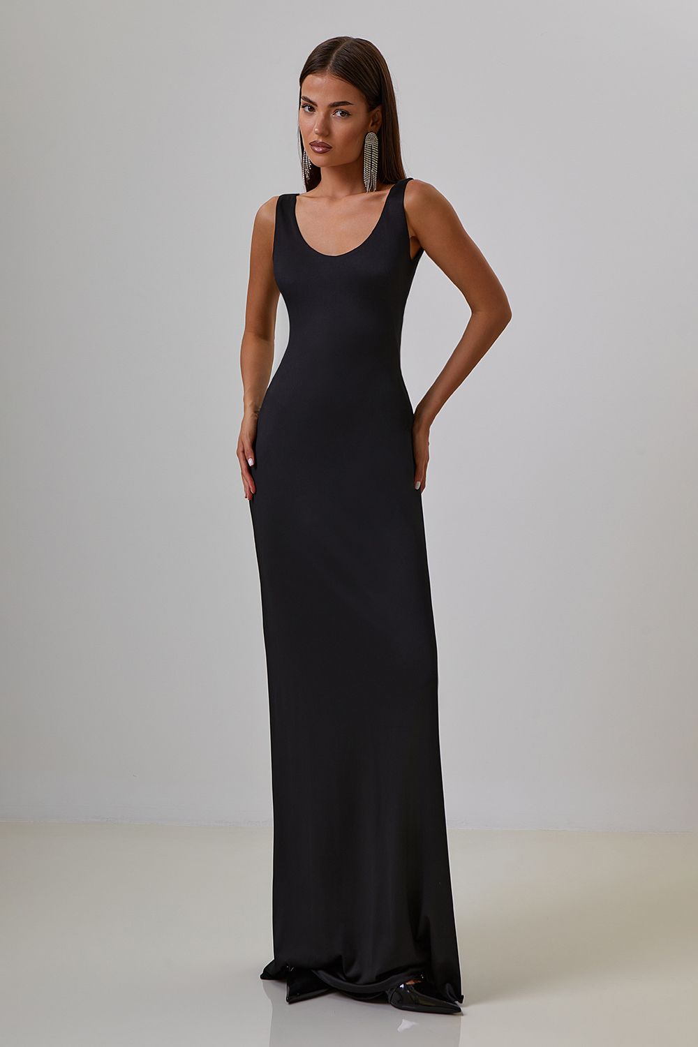 Dress with drapery on the back