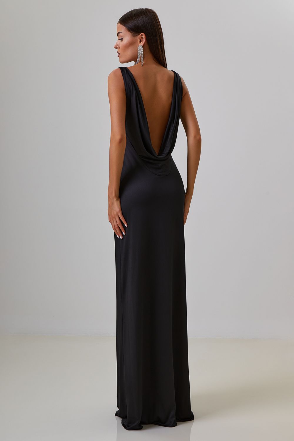 Dress with drapery on the back