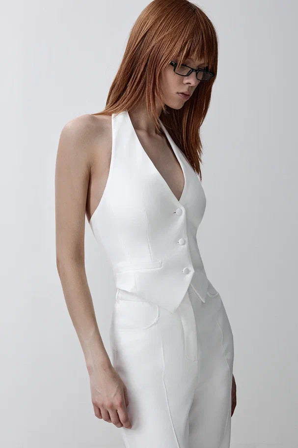 Fitted vest with an open back