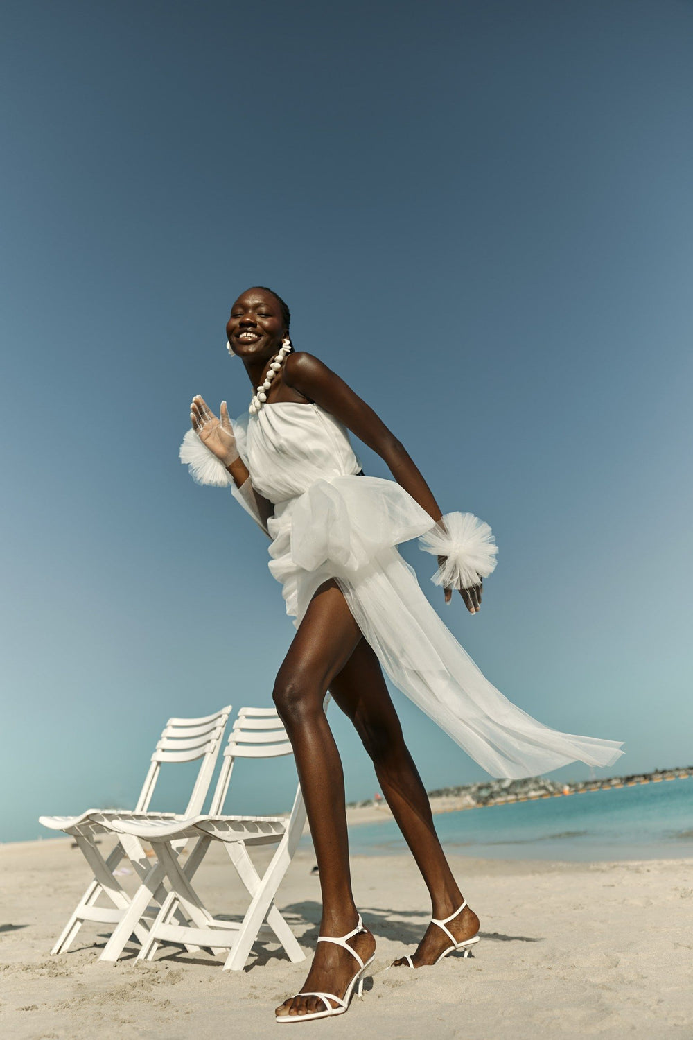 THE BRIDE. THE SEA. THE SUN. AND THE DRESS.