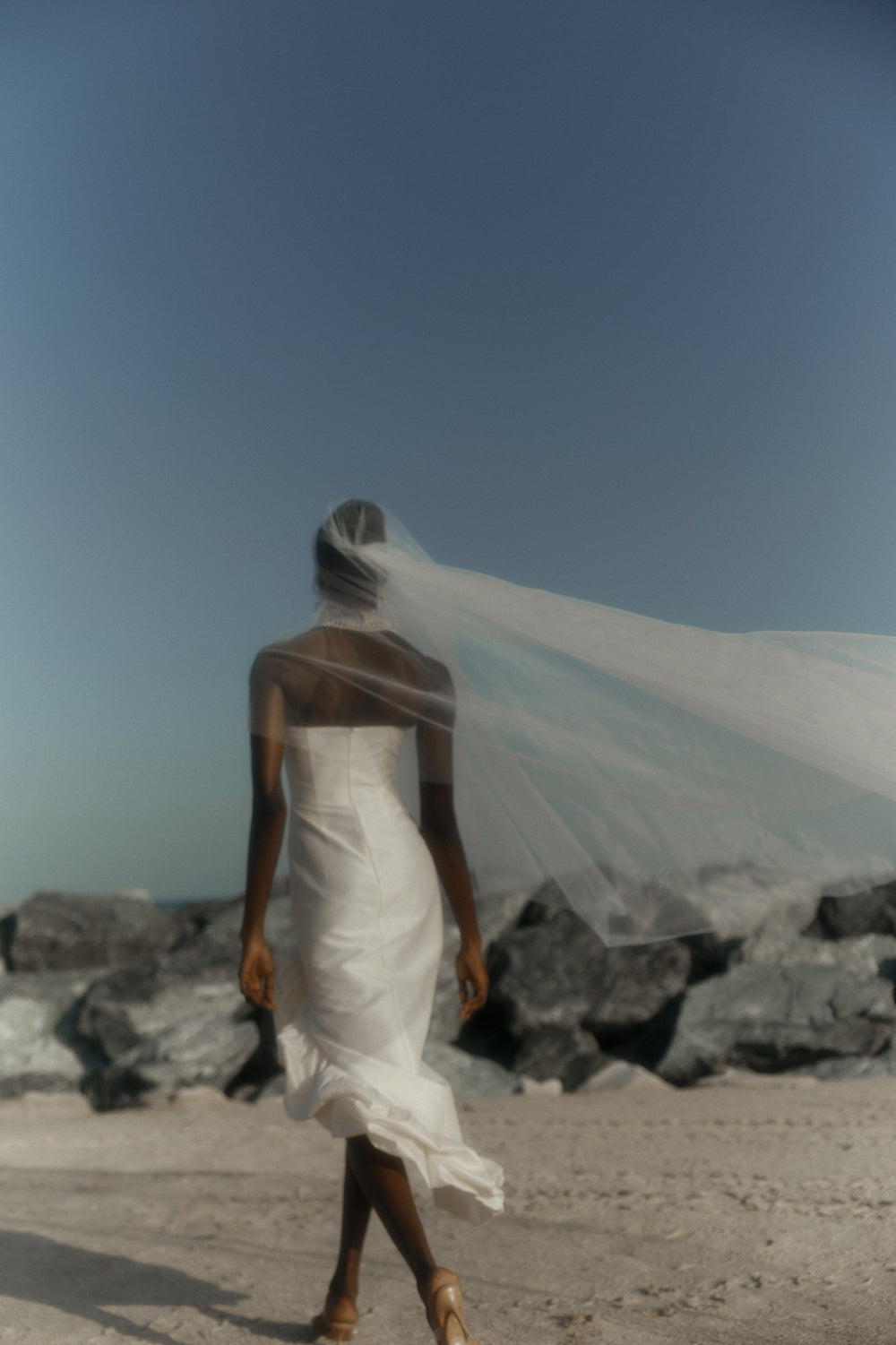THE BRIDE. THE SEA. THE SUN. AND THE DRESS.